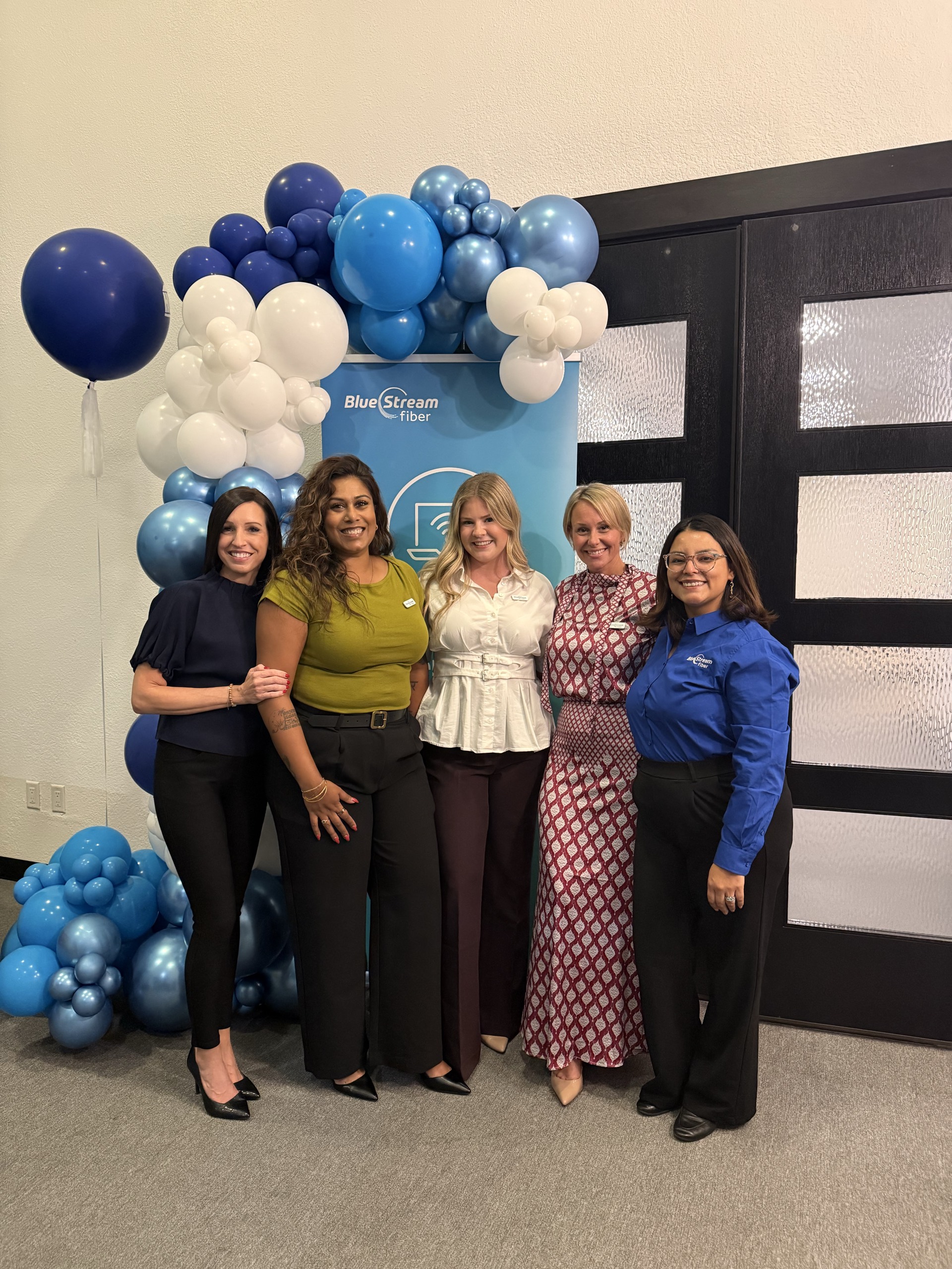 Guests gathered by the Blue Stream Fiber balloon display